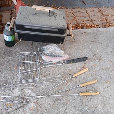 Small propane grill with grilling tools