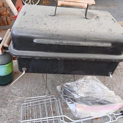 Small propane grill with grilling tools