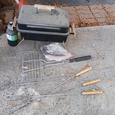 Small propane grill with grilling tools