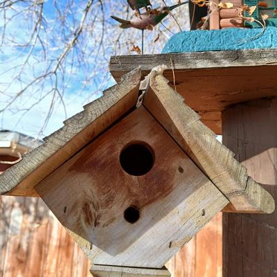 Wooden bird house and log cabin