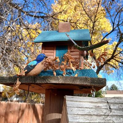 Wooden bird house and log cabin
