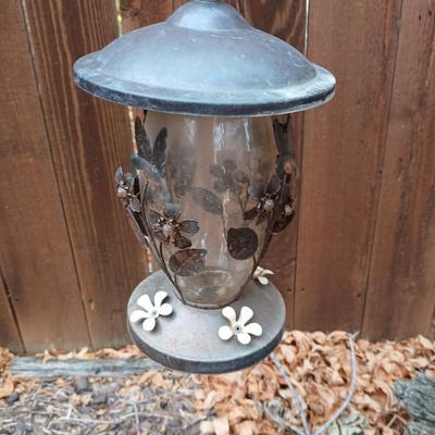 Large unique landscape trunk with hummingbird feeder