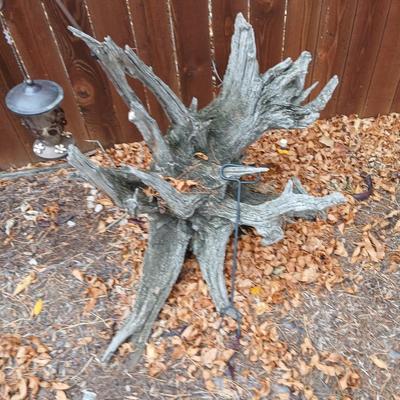 Large unique landscape trunk with hummingbird feeder