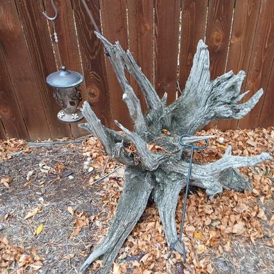Large unique landscape trunk with hummingbird feeder