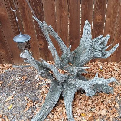 Large unique landscape trunk with hummingbird feeder