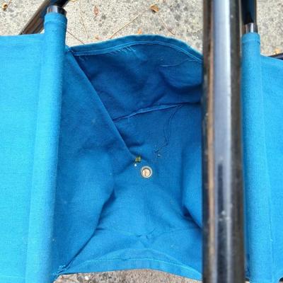 Folding bench with storage in center and a teal cooler
