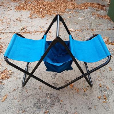 Folding bench with storage in center and a teal cooler