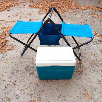 Folding bench with storage in center and a teal cooler