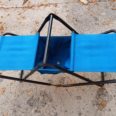 Folding bench with storage in center and a teal cooler