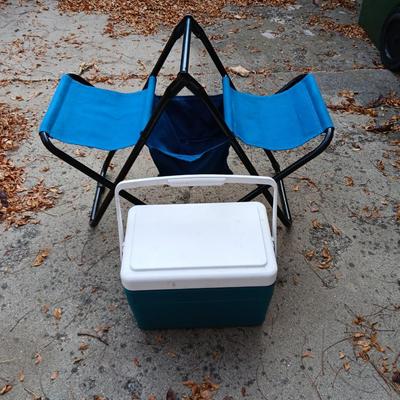 Folding bench with storage in center and a teal cooler