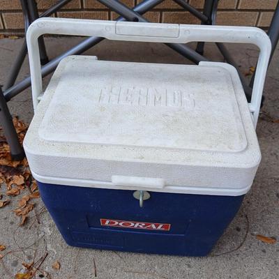 MAC folding chair with side table and a small blue cooler