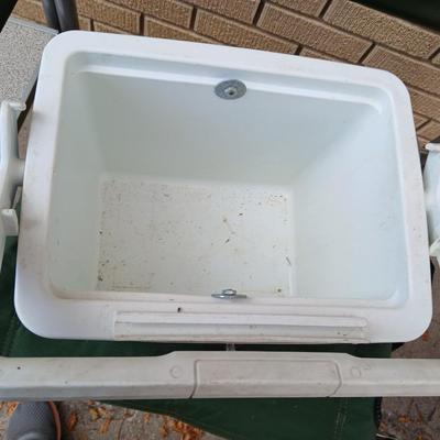 MAC folding chair with side table and a small blue cooler