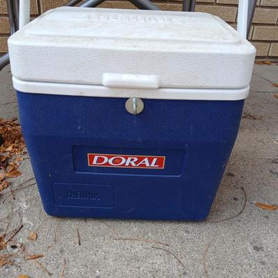 MAC folding chair with side table and a small blue cooler