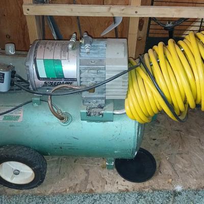 3/4 Horsepower Speedaire air compressor with hose