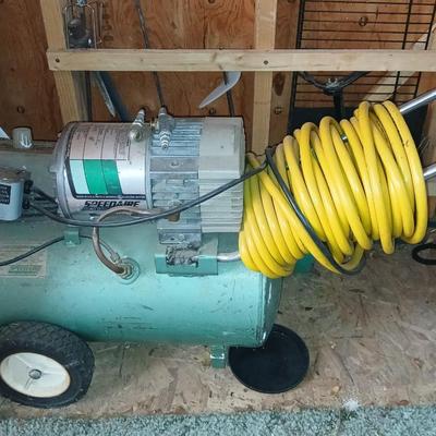 3/4 Horsepower Speedaire air compressor with hose