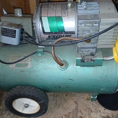 3/4 Horsepower Speedaire air compressor with hose
