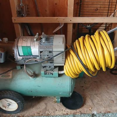 3/4 Horsepower Speedaire air compressor with hose