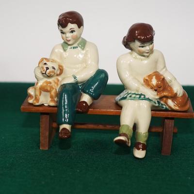CERAMIC ARTS STUDIO - MADISON, WI 1942-1956 BOY ON BENCH W/ DOG & GIRL ON BENCH W/ CAT UNMARKED