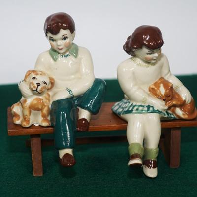 CERAMIC ARTS STUDIO - MADISON, WI 1942-1956 BOY ON BENCH W/ DOG & GIRL ON BENCH W/ CAT UNMARKED