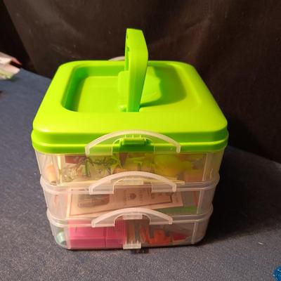 ORGANIZING CONTAINER FULL OF MINIATURE ITEMS