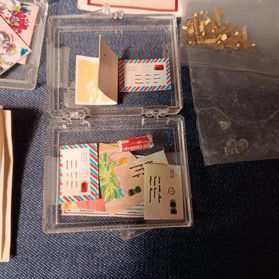 ORGANIZING CONTAINER FULL OF MINIATURE ITEMS
