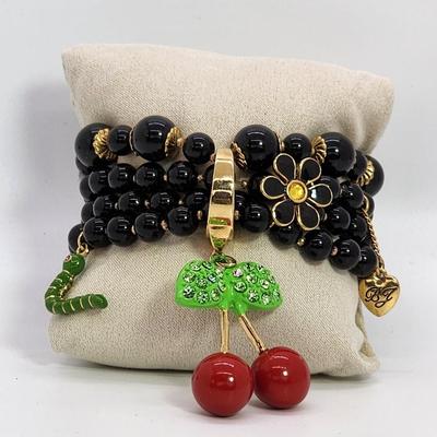LOT 5:: Betsey Johnson Multi bead Charm Bracelet featuring Cherries, flower and lil worm has her hangtag we included a jewelry satchel