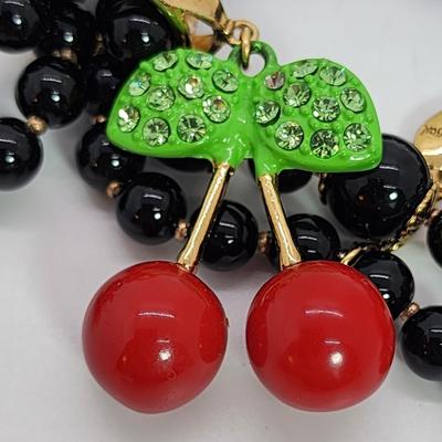 LOT 5:: Betsey Johnson Multi bead Charm Bracelet featuring Cherries, flower and lil worm has her hangtag we included a jewelry satchel