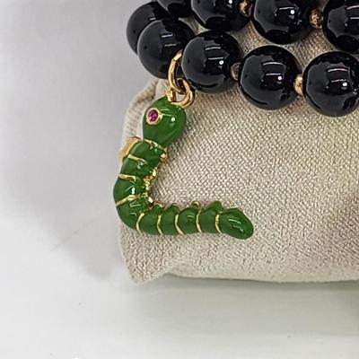 LOT 5:: Betsey Johnson Multi bead Charm Bracelet featuring Cherries, flower and lil worm has her hangtag we included a jewelry satchel