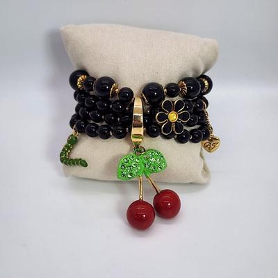 LOT 5:: Betsey Johnson Multi bead Charm Bracelet featuring Cherries, flower and lil worm has her hangtag we included a jewelry satchel