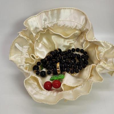 LOT 5:: Betsey Johnson Multi bead Charm Bracelet featuring Cherries, flower and lil worm has her hangtag we included a jewelry satchel