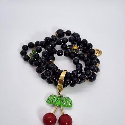 LOT 5:: Betsey Johnson Multi bead Charm Bracelet featuring Cherries, flower and lil worm has her hangtag we included a jewelry satchel