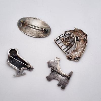 LOT 6:: FOUR Sterling Brooches- Enamel and Marcasite Scottie dog, Enamel Maple Leaf "Mother" Pin, an Owl marked JA- James...