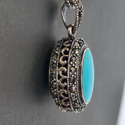 LOT 34:: Sterling Turquoise and Marcasite double sided pendant on 16" L 925 Italy chain