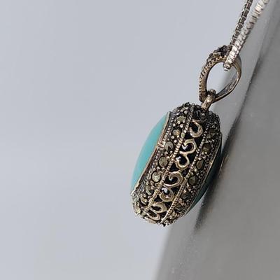 LOT 34:: Sterling Turquoise and Marcasite double sided pendant on 16" L 925 Italy chain
