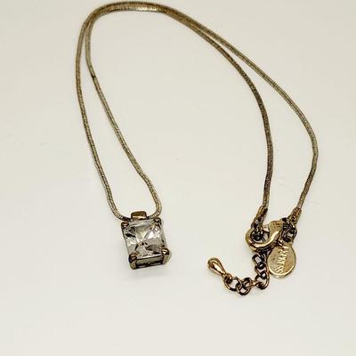 LOT 96:: Triple Strand Faux Glass Pearls with Accent Bow, Matching Bracelet and a Goldtone CZ Pendant Necklace by Express