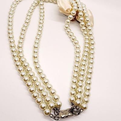LOT 96:: Triple Strand Faux Glass Pearls with Accent Bow, Matching Bracelet and a Goldtone CZ Pendant Necklace by Express