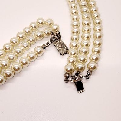 LOT 96:: Triple Strand Faux Glass Pearls with Accent Bow, Matching Bracelet and a Goldtone CZ Pendant Necklace by Express
