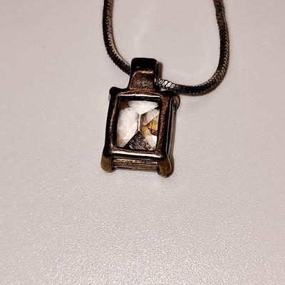 LOT 96:: Triple Strand Faux Glass Pearls with Accent Bow, Matching Bracelet and a Goldtone CZ Pendant Necklace by Express