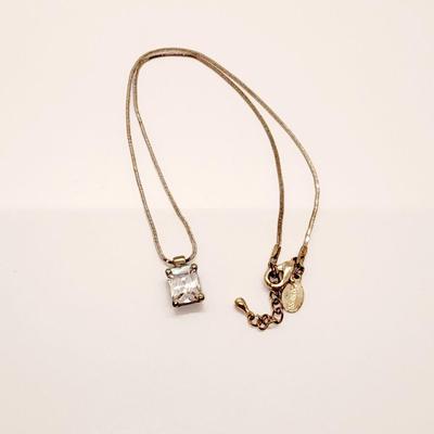 LOT 96:: Triple Strand Faux Glass Pearls with Accent Bow, Matching Bracelet and a Goldtone CZ Pendant Necklace by Express