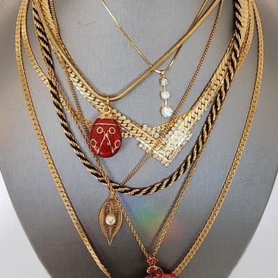 LOT:: Fashion Necklaces and a long gold tone wrap bracelet, featuring Trifari Chain and more