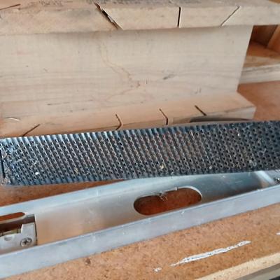 Two levels a hammer, mitre box and a Vintage Stanley Rasp