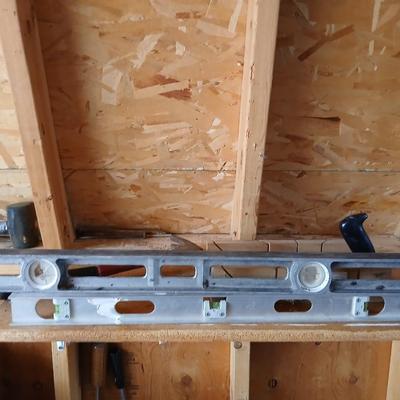 Two levels a hammer, mitre box and a Vintage Stanley Rasp
