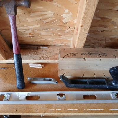 Two levels a hammer, mitre box and a Vintage Stanley Rasp