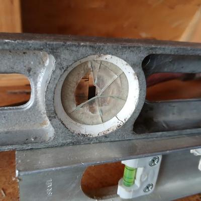 Two levels a hammer, mitre box and a Vintage Stanley Rasp
