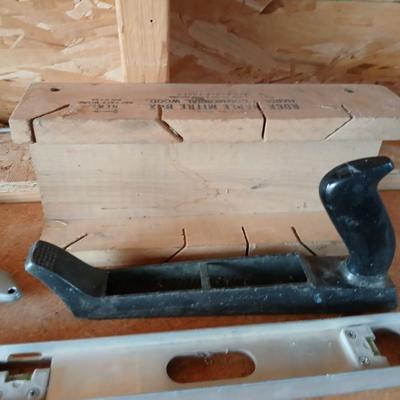 Two levels a hammer, mitre box and a Vintage Stanley Rasp