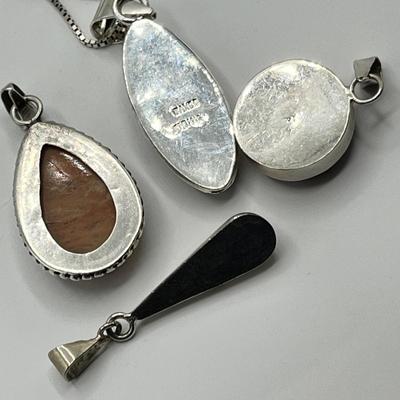 Lot 492 Sterling pendants w/ stones