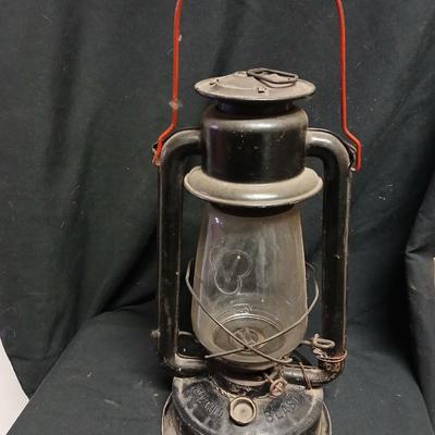 Vintage kerosene lantern marked Marshwells No. 32 Cold Blast with embossed globe