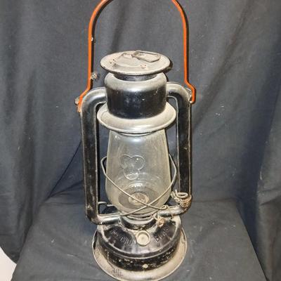 Vintage kerosene lantern marked Marshwells No. 32 Cold Blast with embossed globe