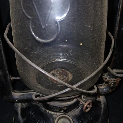 Vintage kerosene lantern marked Marshwells No. 32 Cold Blast with embossed globe