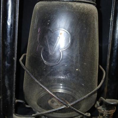 Vintage kerosene lantern marked Marshwells No. 32 Cold Blast with embossed globe